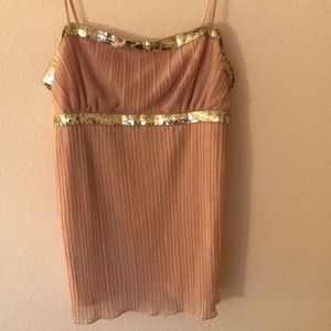 Cream color with gold specks. Light material